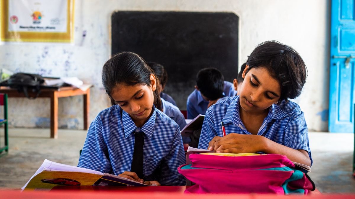Illustrative photograph of schoolchildren reading together