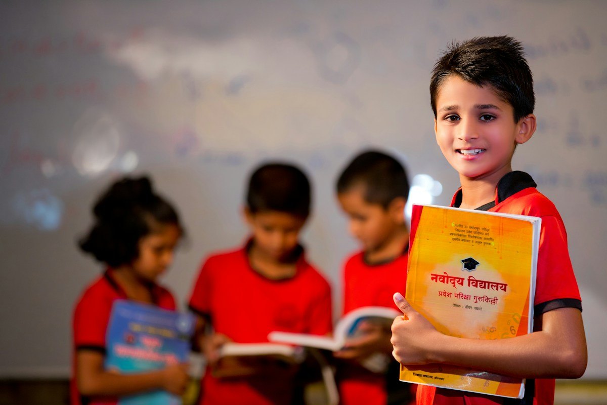 Illustrative smiling student holding a book in a school environment